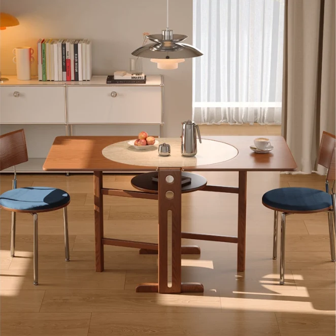Esstisch aus Massivholz mit zwei Klappblättern und Tischplatte aus Sinterstein