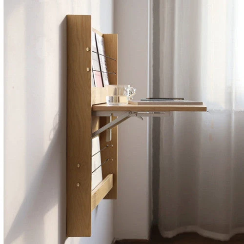 An der Wand befestigter faltbarer Schreibtisch mit Lagerregal