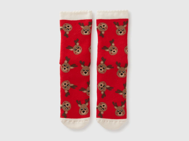 Rote, rutschfeste Socken mit Rentiermotiv