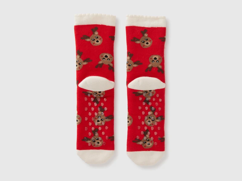 Rote, rutschfeste Socken mit Rentiermotiv
